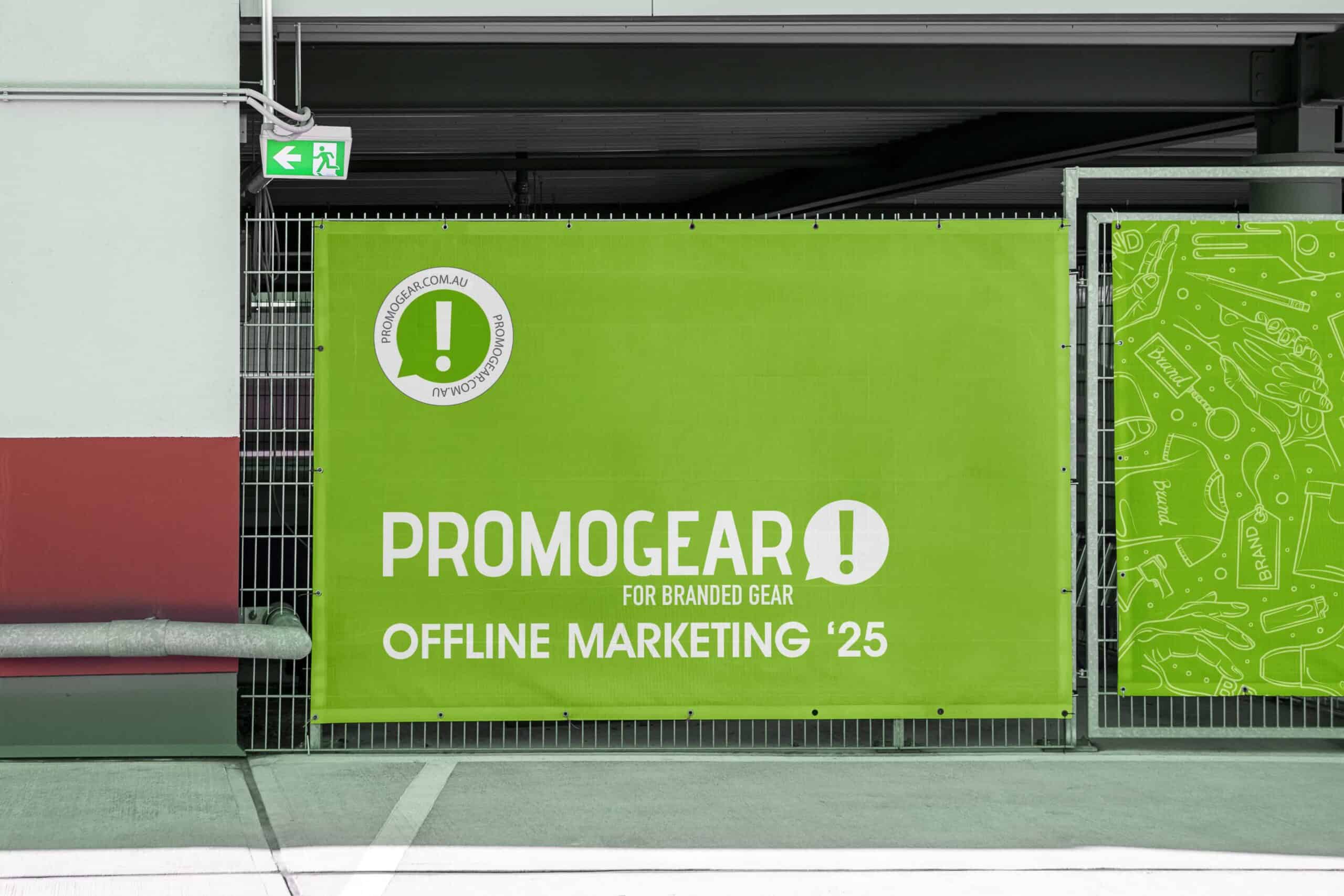 PromoGear outdoor banner hung up on chain link fence